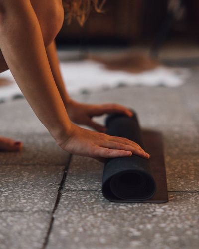 Close-up of hands in a mindful position during a yoga practice.